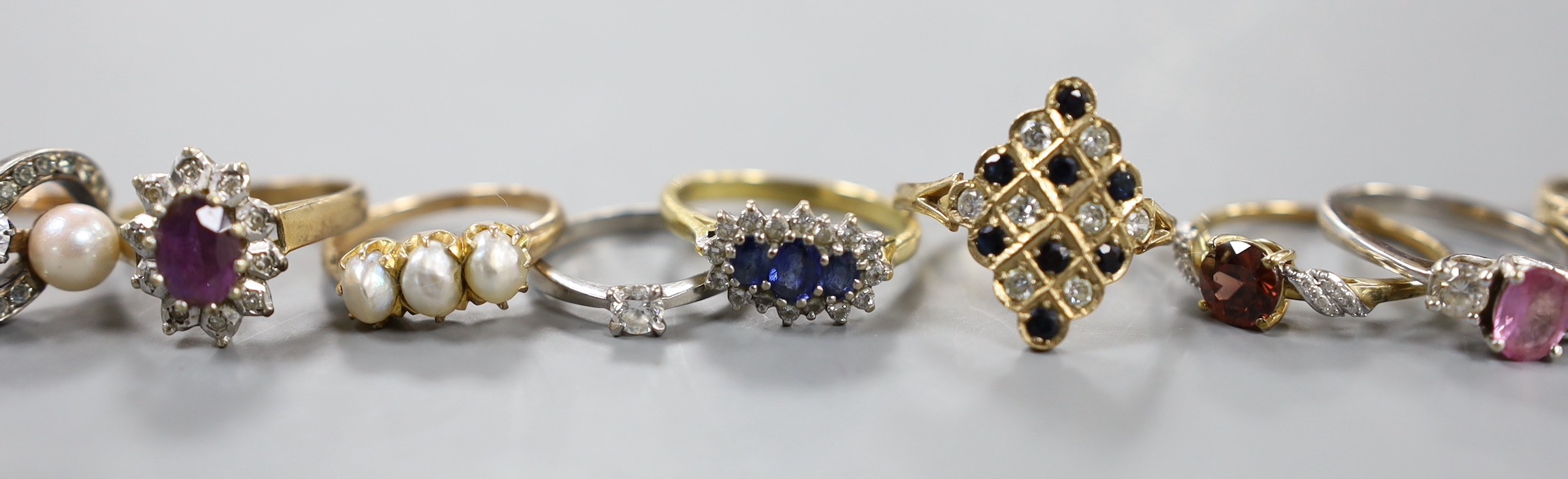A modern platinum and solitaire diamond set ring, size G, gross weight 1.4 grams, four assorted 18ct gold and gem set rings including diamond chip half eternity and a pair of Italian 750 and cultured pearl earrings, gros